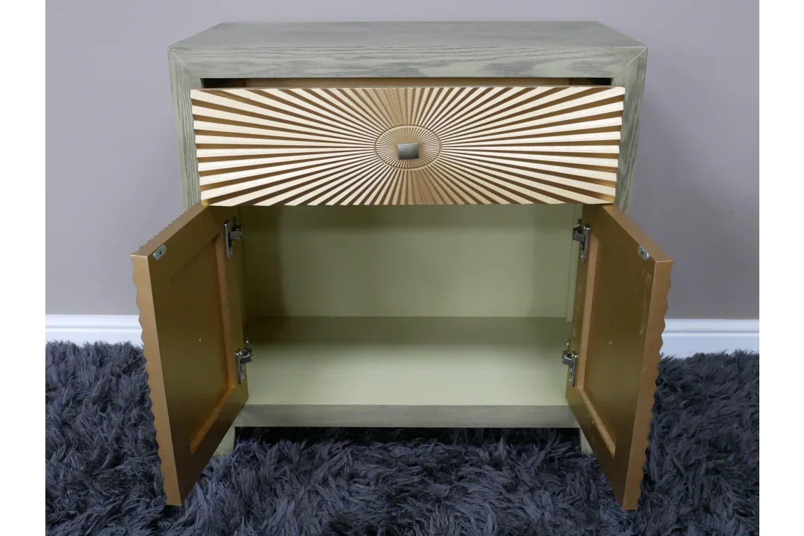 Wooden cabinet with gold sunburst drawer detail, open doors, and internal storage compartment