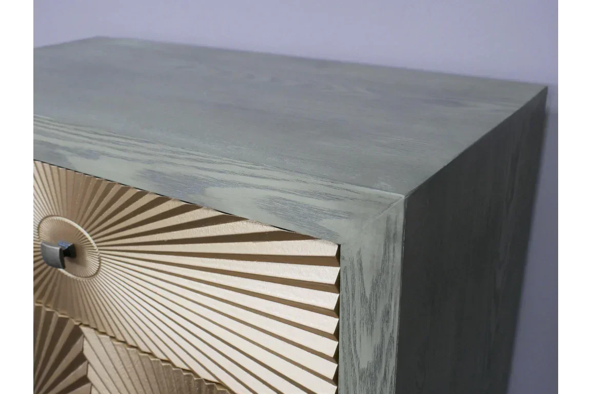 Contemporary wooden chest of drawers with grey finish and gold sunburst drawer fronts