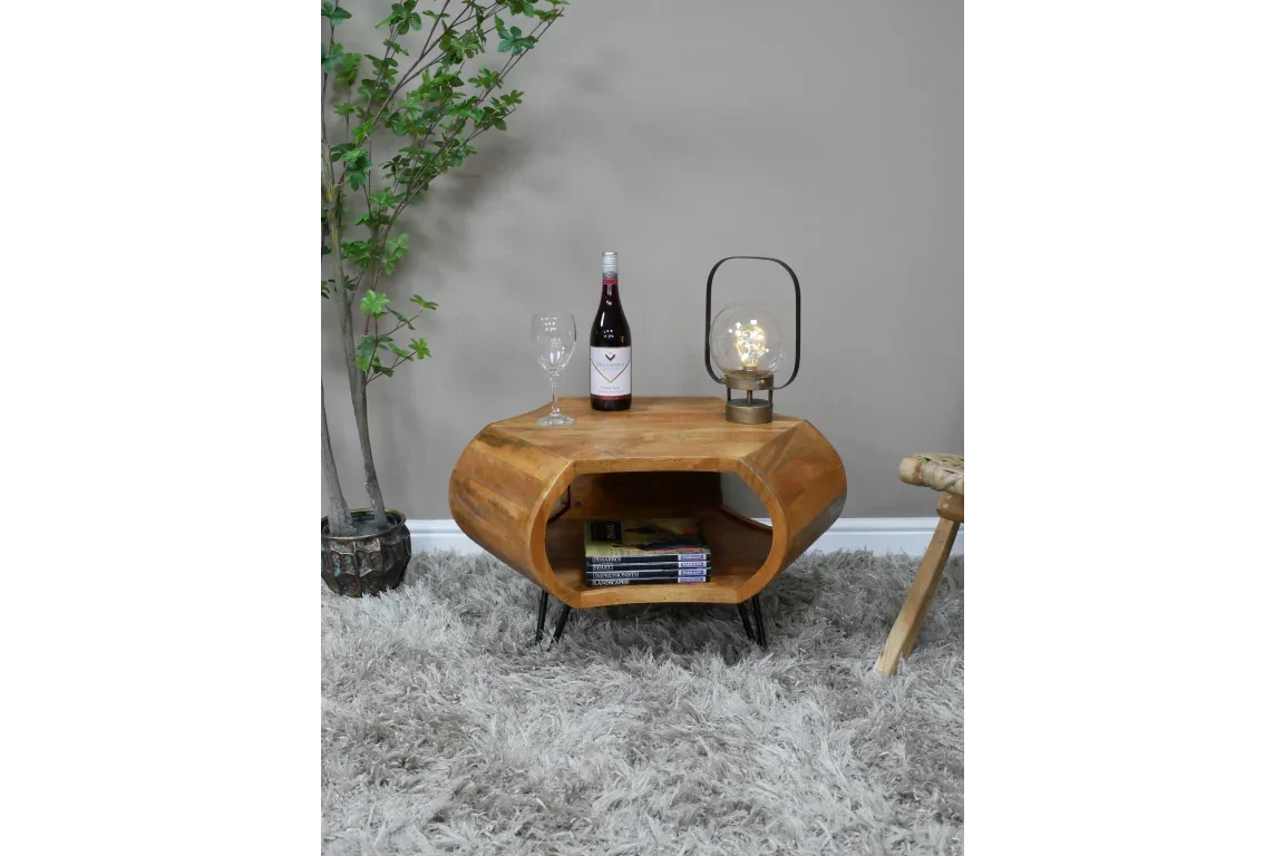 Modern wooden coffee table with open shelf, wine bottle, lamp and glass on grey rug