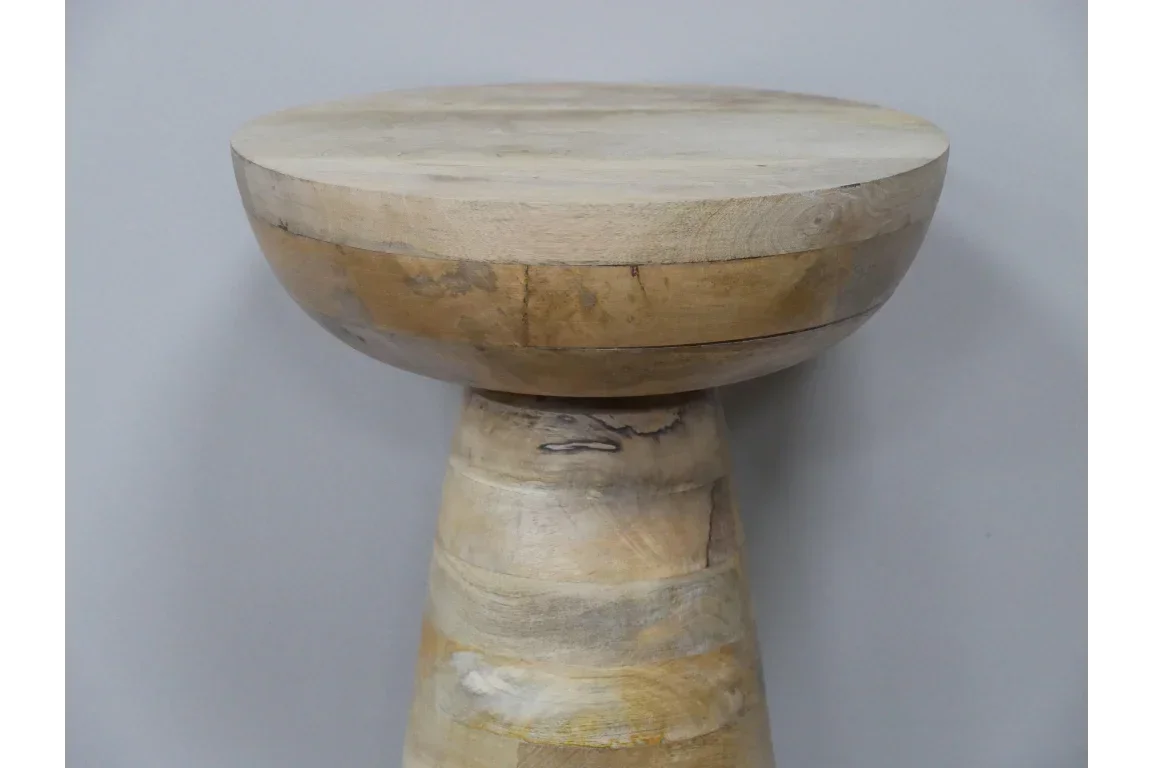 Round wooden side table with natural light wood grain and smooth finish, shown in close-up
