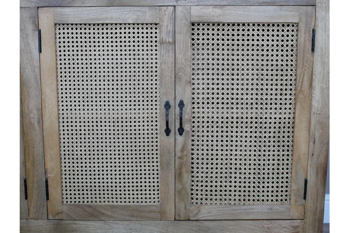 Wooden storage cabinet with rattan doors and black metal handles