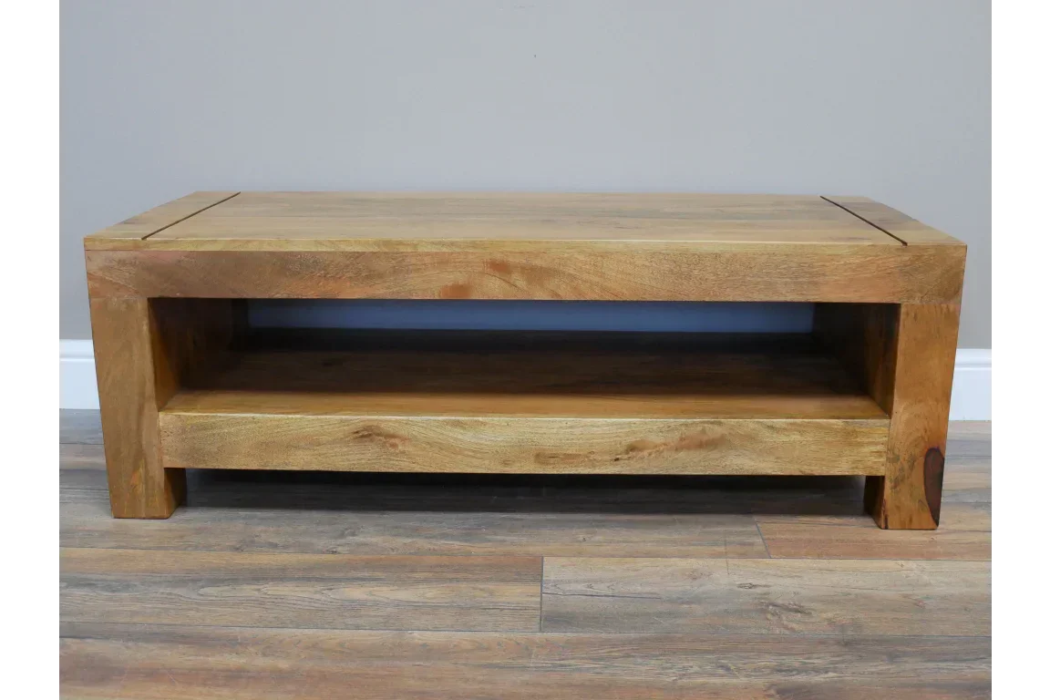 Solid wood coffee table with lower shelf and natural finish on wooden floor
