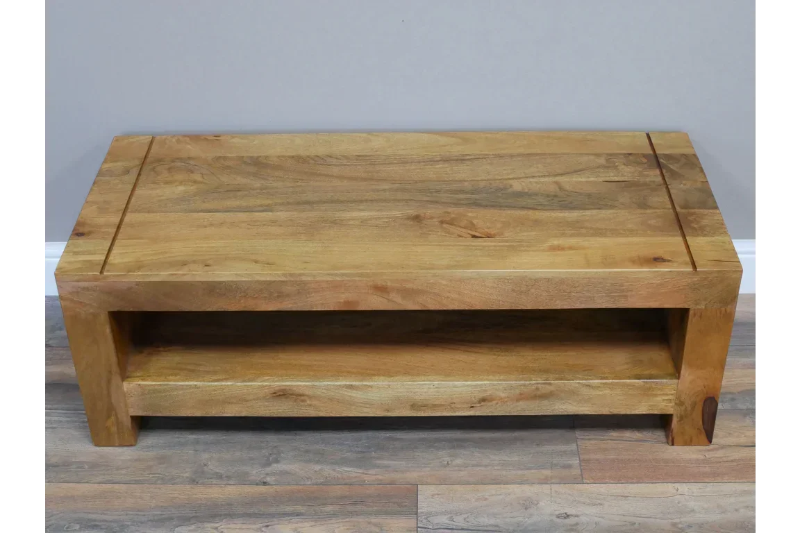 Rectangular solid wood coffee table with shelf, natural finish, on wooden floor