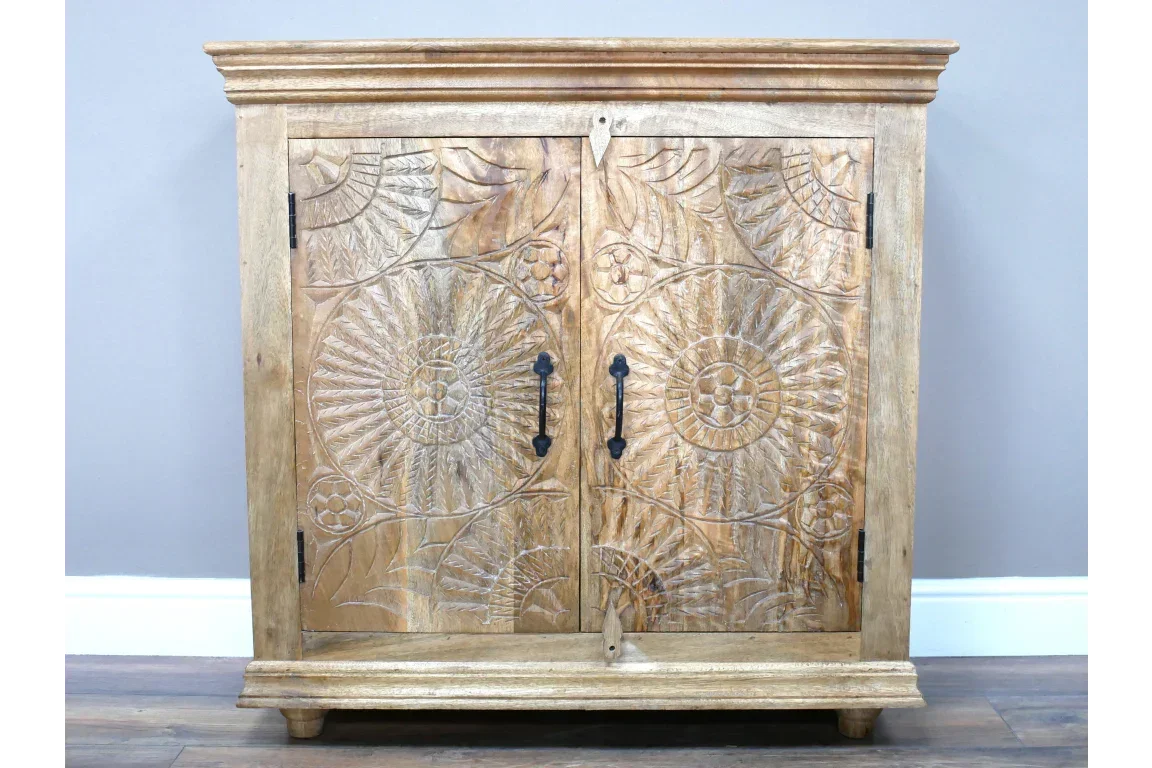 Mango wood sideboard with carved floral front panels and black metal handles