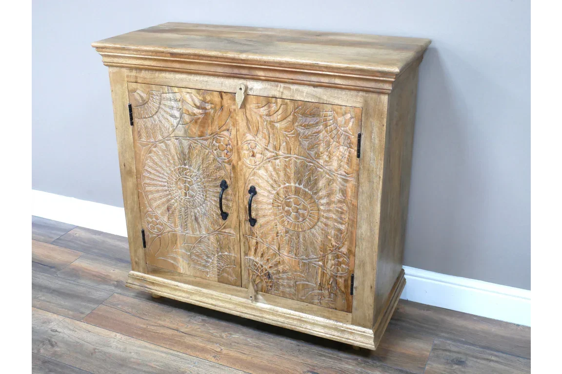 Natural wood sideboard cabinet with carved floral doors and black metal handles