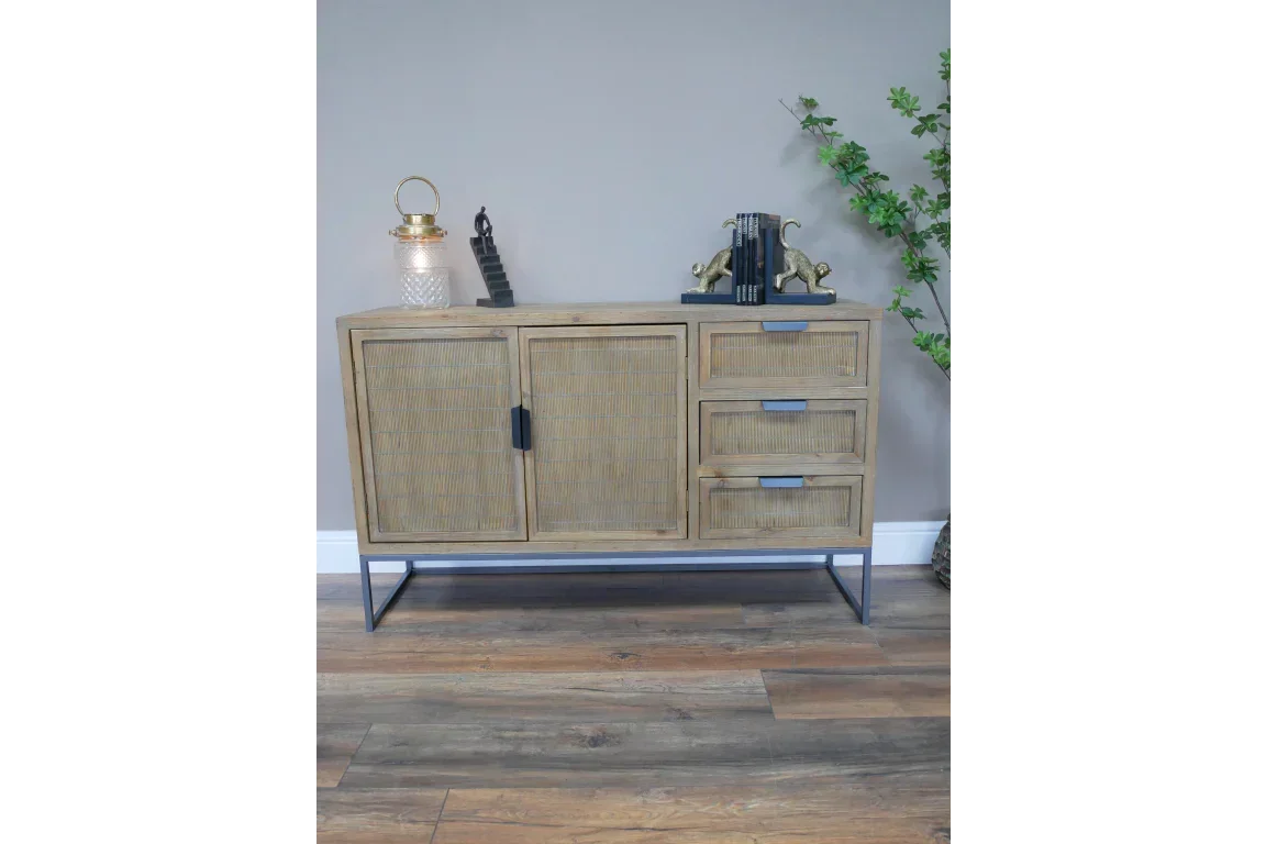Rattan sideboard with two doors and three drawers on black metal legs in living room setting