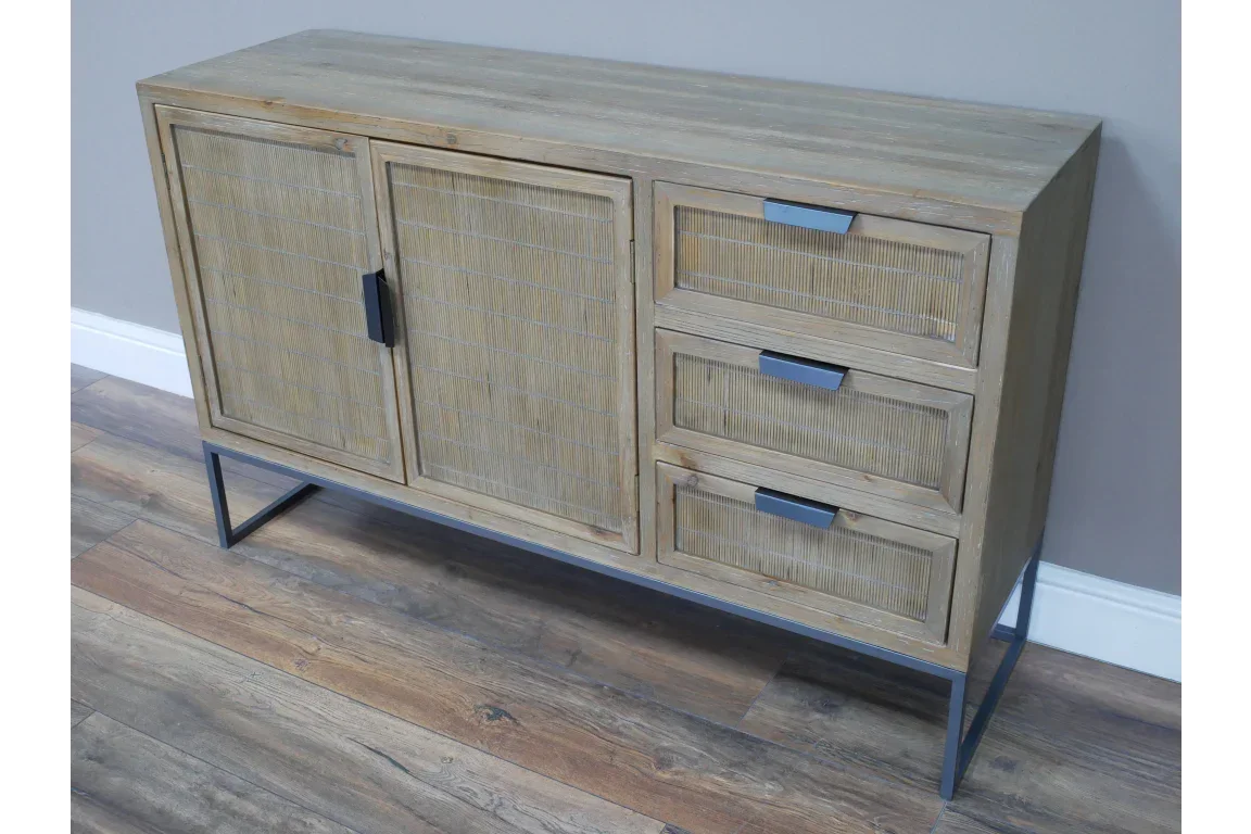Light wood sideboard with metal legs, two doors and three drawers, set against grey wall