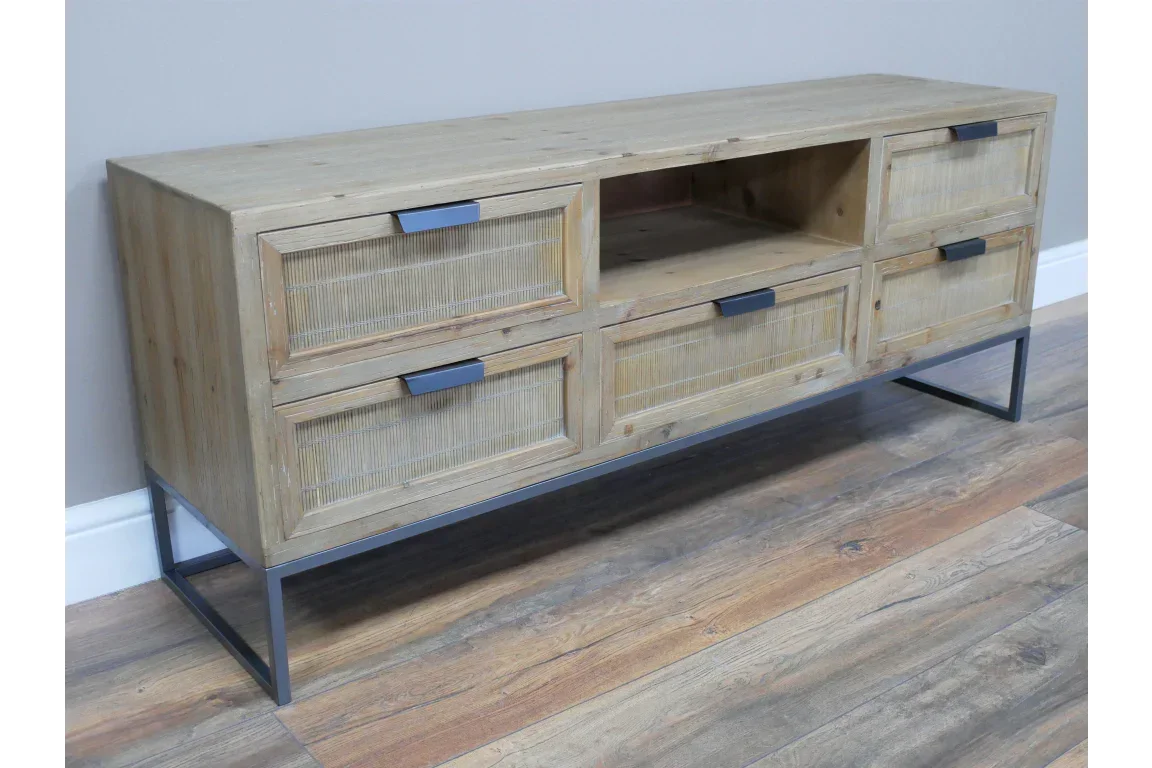 Light wood TV unit with four drawers, open shelf and metal legs on wooden floor