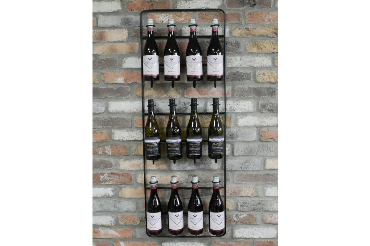 Wall-mounted metal wine rack with twelve wine bottles against a brick wall