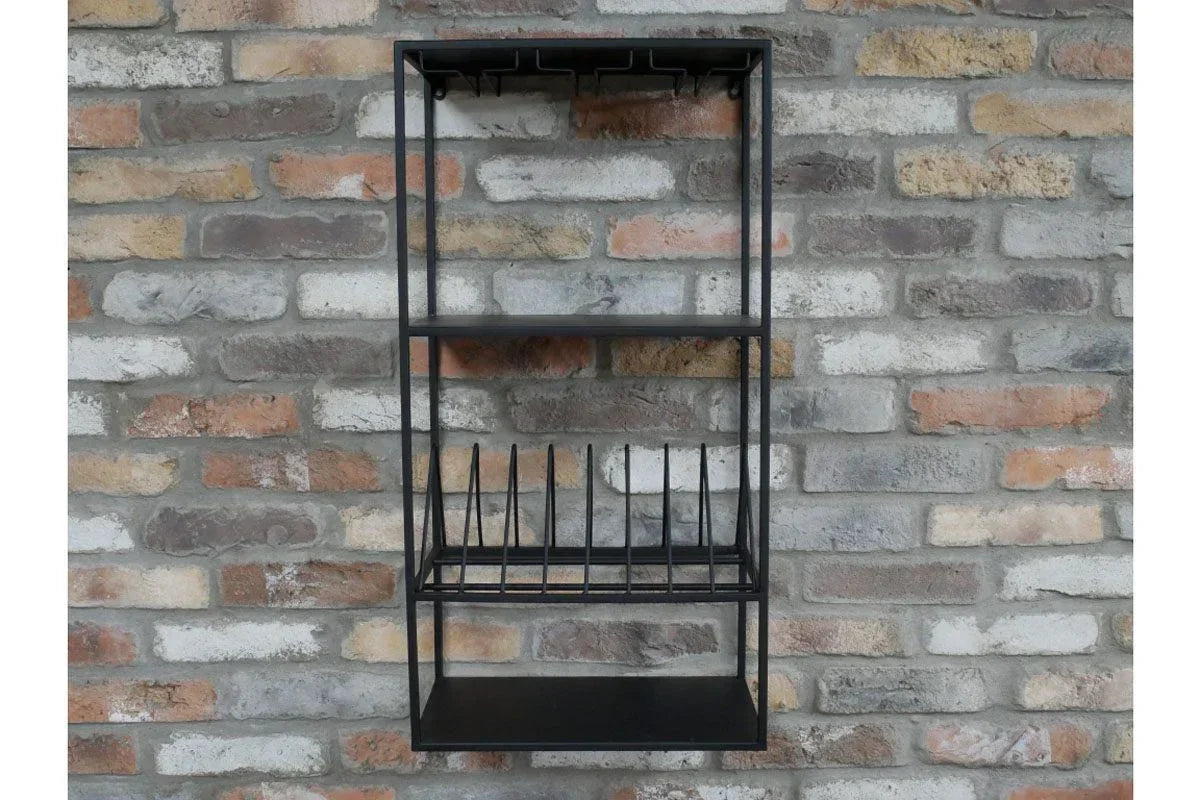 Black metal kitchen wall rack with wine glass holders and plate storage on brick wall