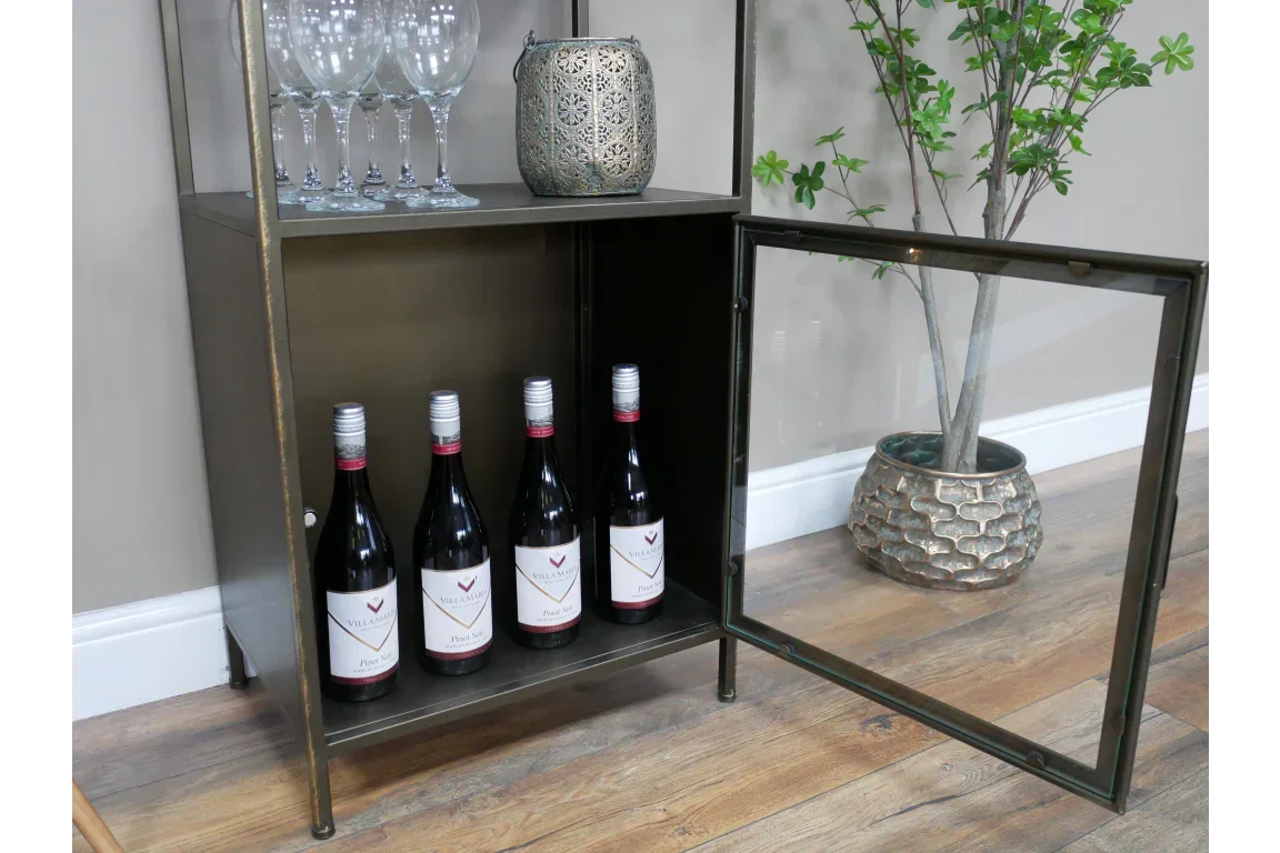 Metal drinks cabinet with glass door open, displaying wine bottles on lower shelf