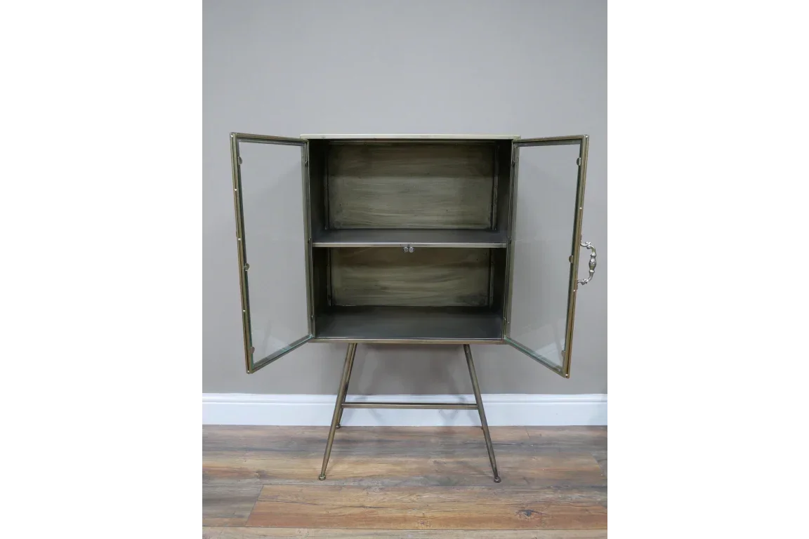 Metal display cabinet with glass doors and two shelves on angled legs
