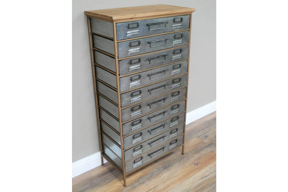 Tall industrial storage chest with metal drawers and wooden frame on laminate flooring