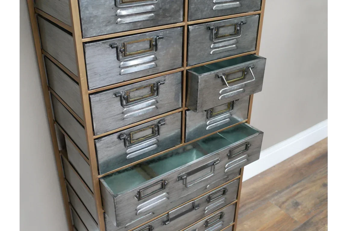 Tall metal storage chest with multiple drawers and brass handles, two drawers open