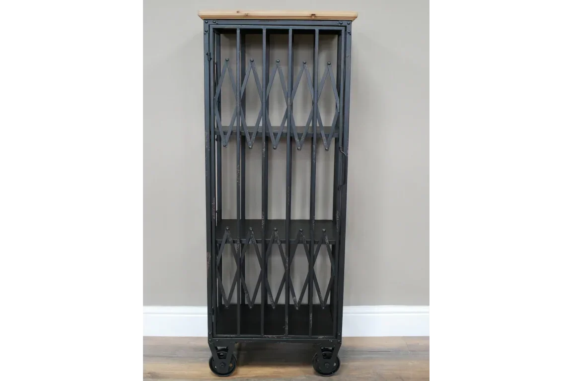 Industrial metal storage cabinet with wooden top and casters against grey wall