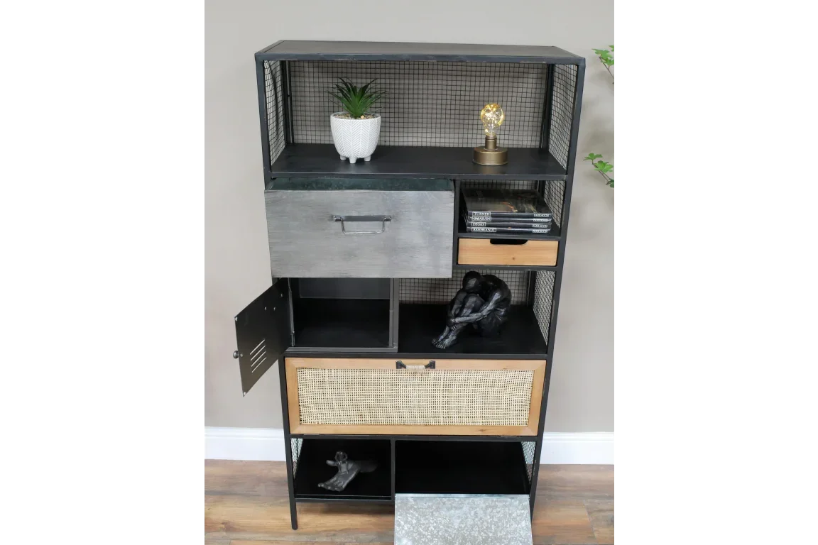 Industrial shelving unit with wire mesh sides, mixed drawers, decor objects, and plant