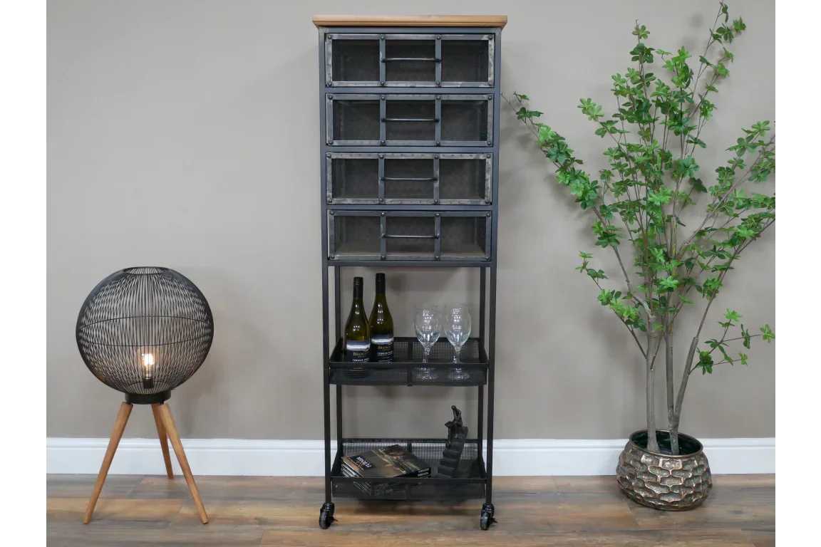 Industrial metal storage cabinet with mesh drawers and wood top, styled with wine and glasses