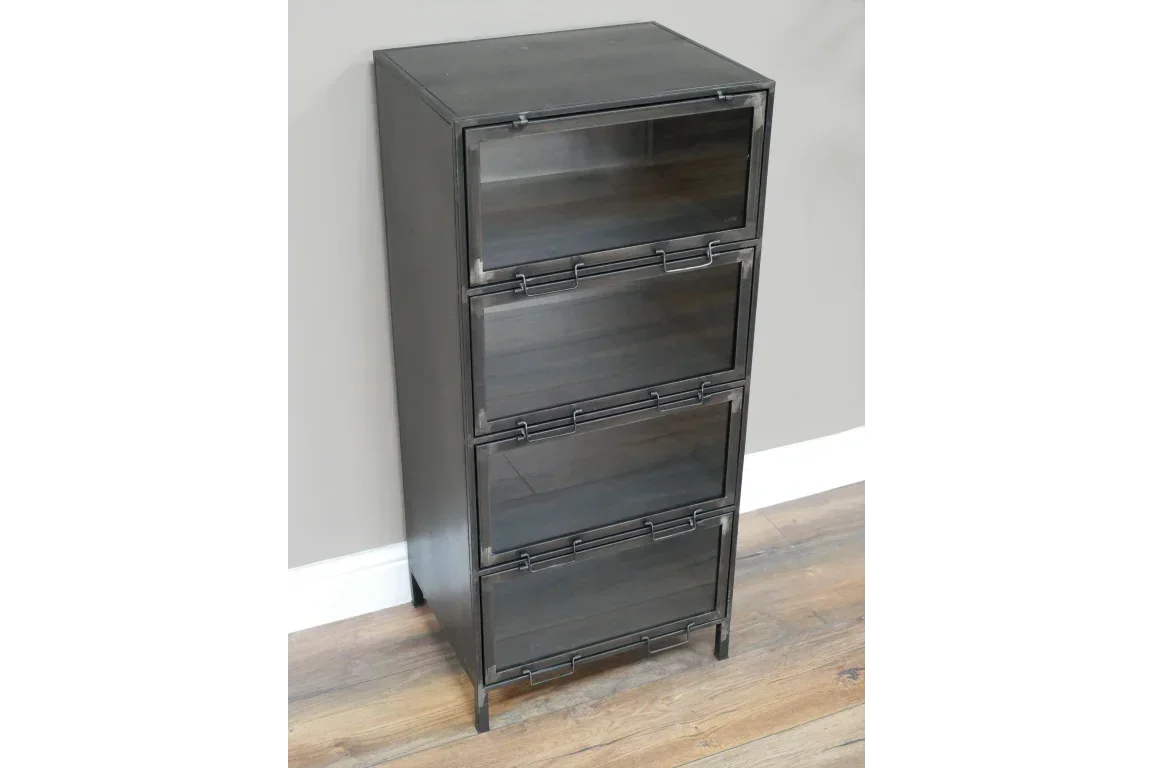 Black metal storage cabinet with four front-opening compartments on wooden floor