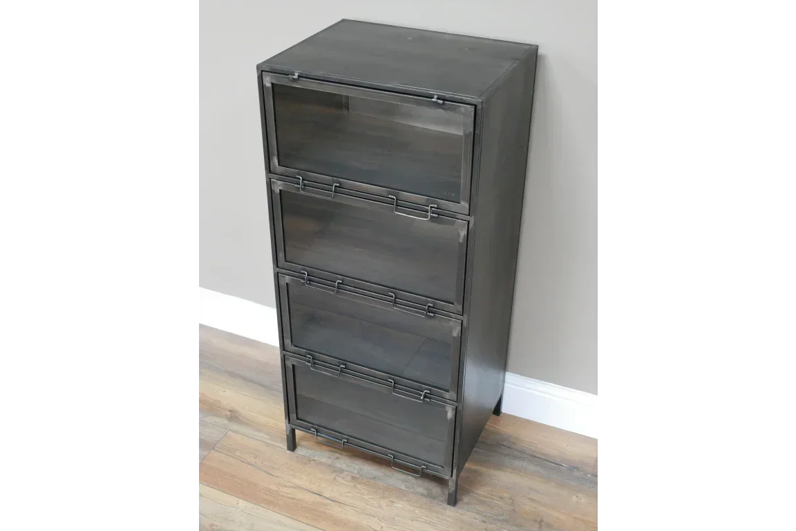 Black metal storage cabinet with four glass-front drawers on wood floor
