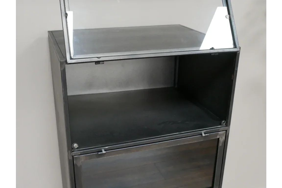 Black metal storage cabinet with open glass door and empty interior shelf
