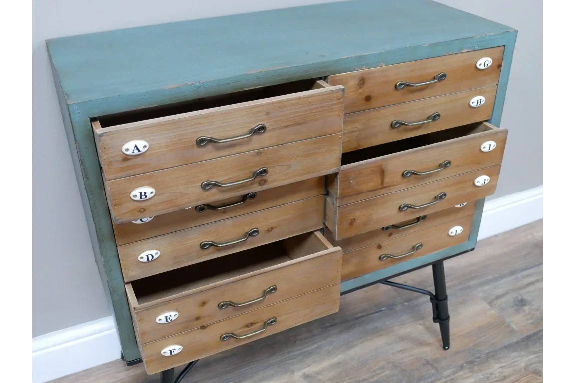 Wooden chest of drawers with vintage handles, blue frame and labelled drawer fronts