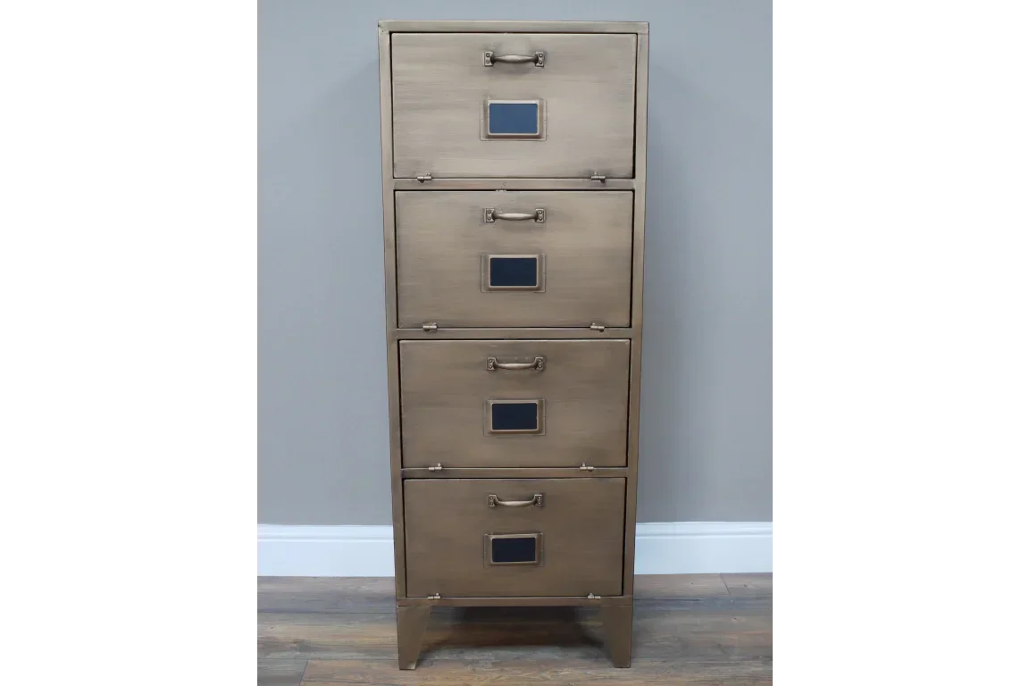 Brushed metal four drawer filing cabinet with label holders and handles, against grey wall