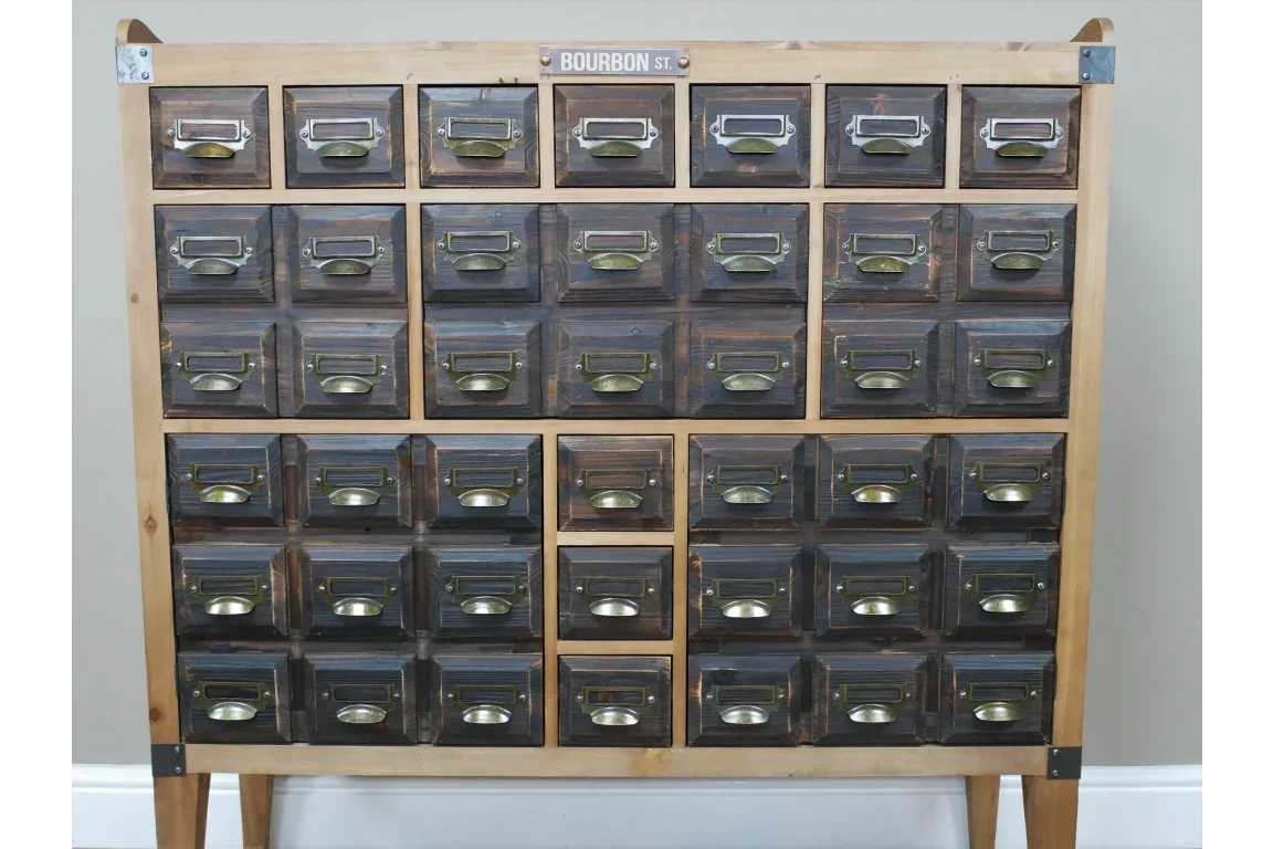 Vintage wooden storage cabinet with 25 dark wood drawers and brass handles