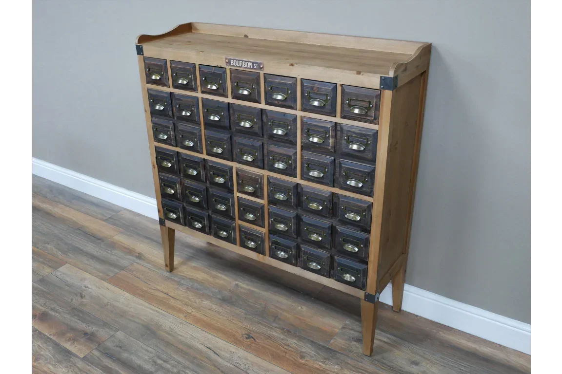 Vintage wooden storage cabinet with thirty small drawers and metal label pulls