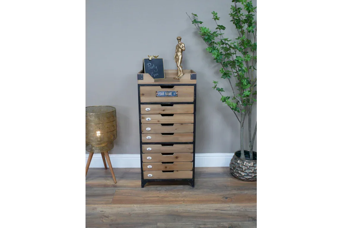 Industrial wood chest of drawers with metal frame, styled with lamp and potted plant