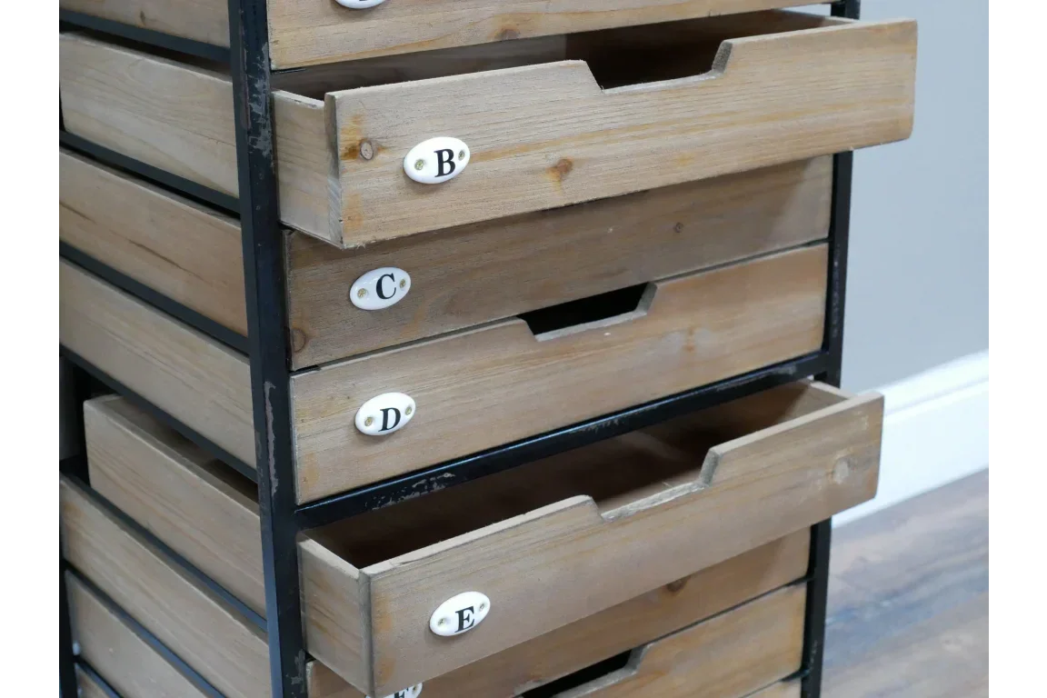Wooden storage unit with labeled drawers and black metal frame