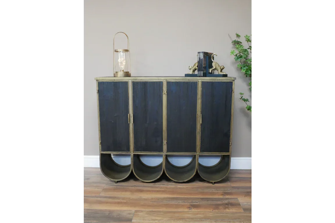 Black and gold metal sideboard with four doors and semicircle base, styled in modern room