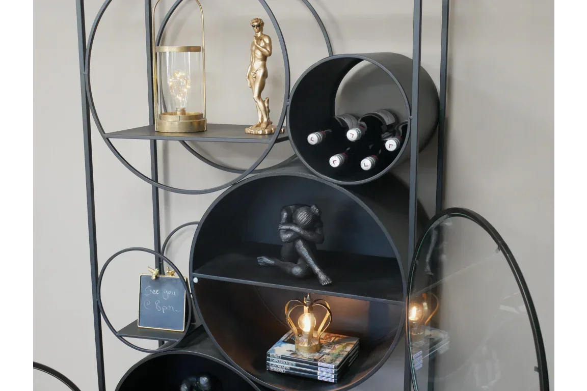 Modern metal shelving unit with wine rack, decorative figures and ambient lighting