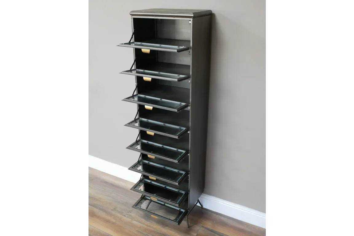 Tall black metal shoe cabinet with seven pull-down compartments against a grey wall