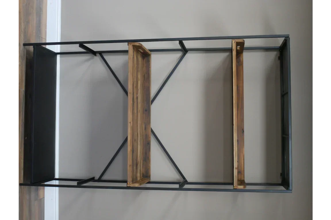 Industrial shelving unit with black metal frame and two wooden shelves against wall