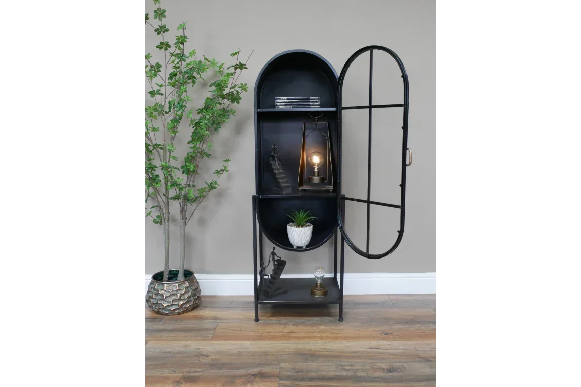 Tall black metal display cabinet with arched top, open door, shelves and decor accents