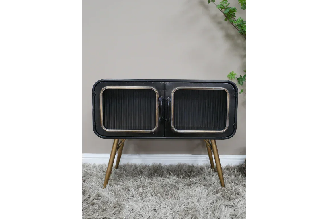 Black sideboard cabinet with glass doors and gold legs on gray rug