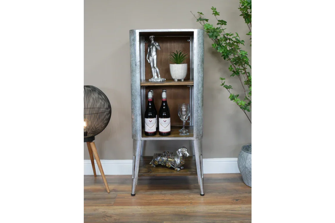 Industrial metal display cabinet with shelves, holding decor, wine bottles and glassware