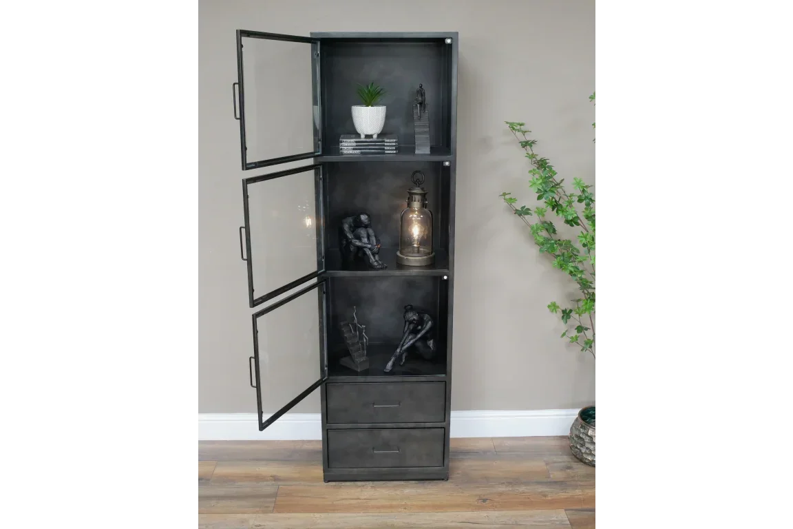 Tall black display cabinet with glass doors, shelves, ornaments, and two drawers