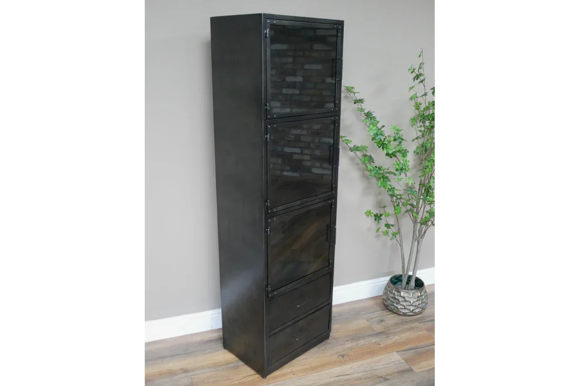 Tall black metal storage cabinet with glass doors and drawers against wall