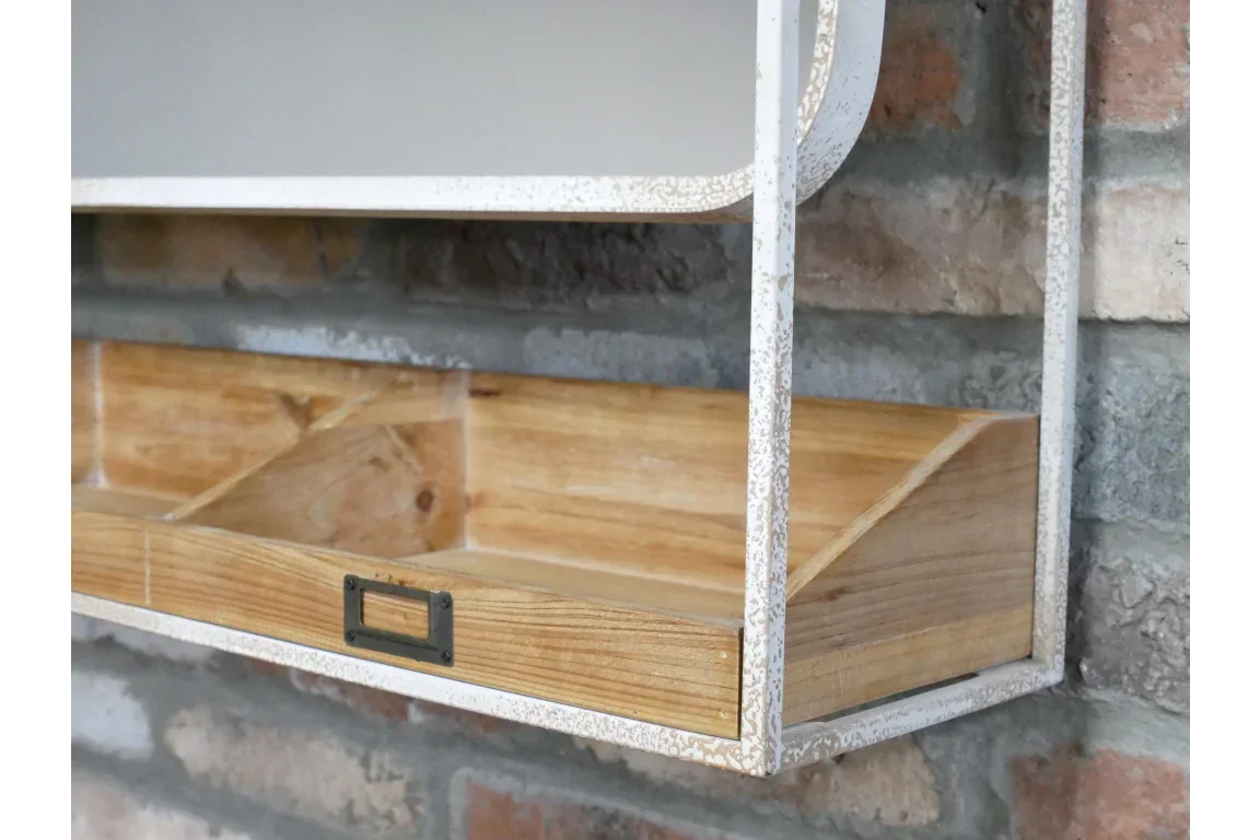 Wall-mounted storage shelf with white metal frame and wooden compartments against brick wall