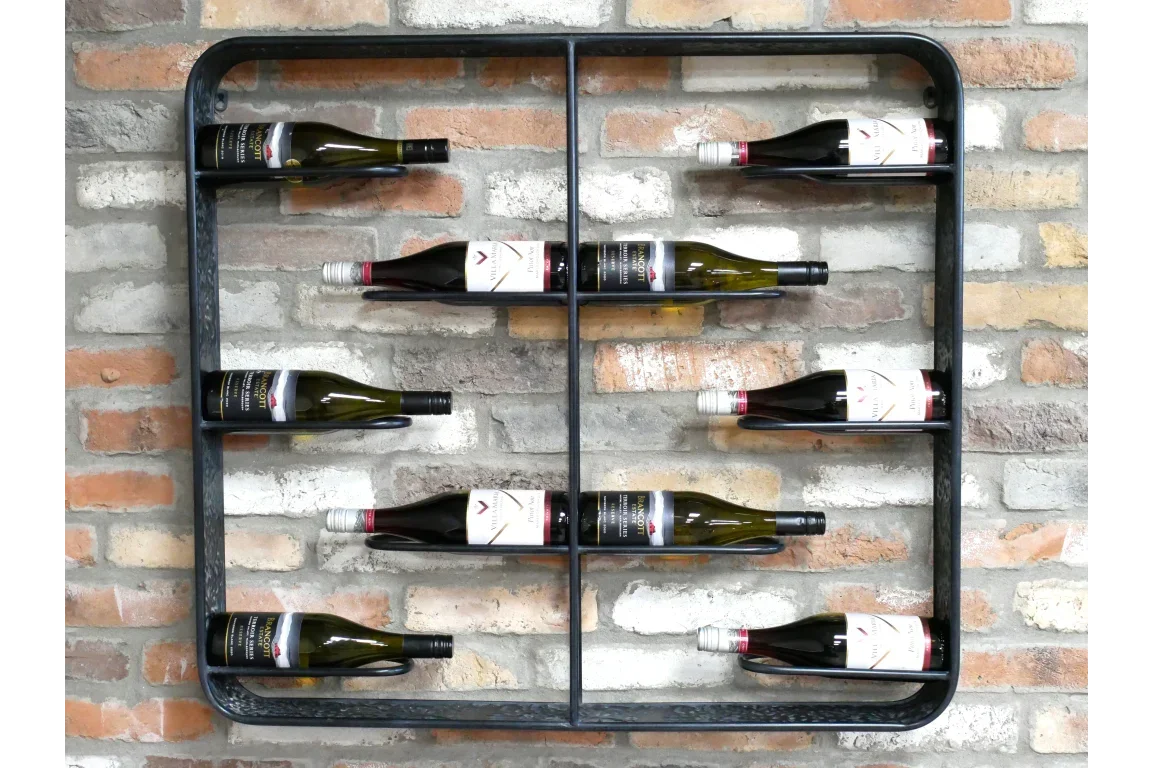 Wall mounted metal wine rack with eight wine bottles on exposed brick background
