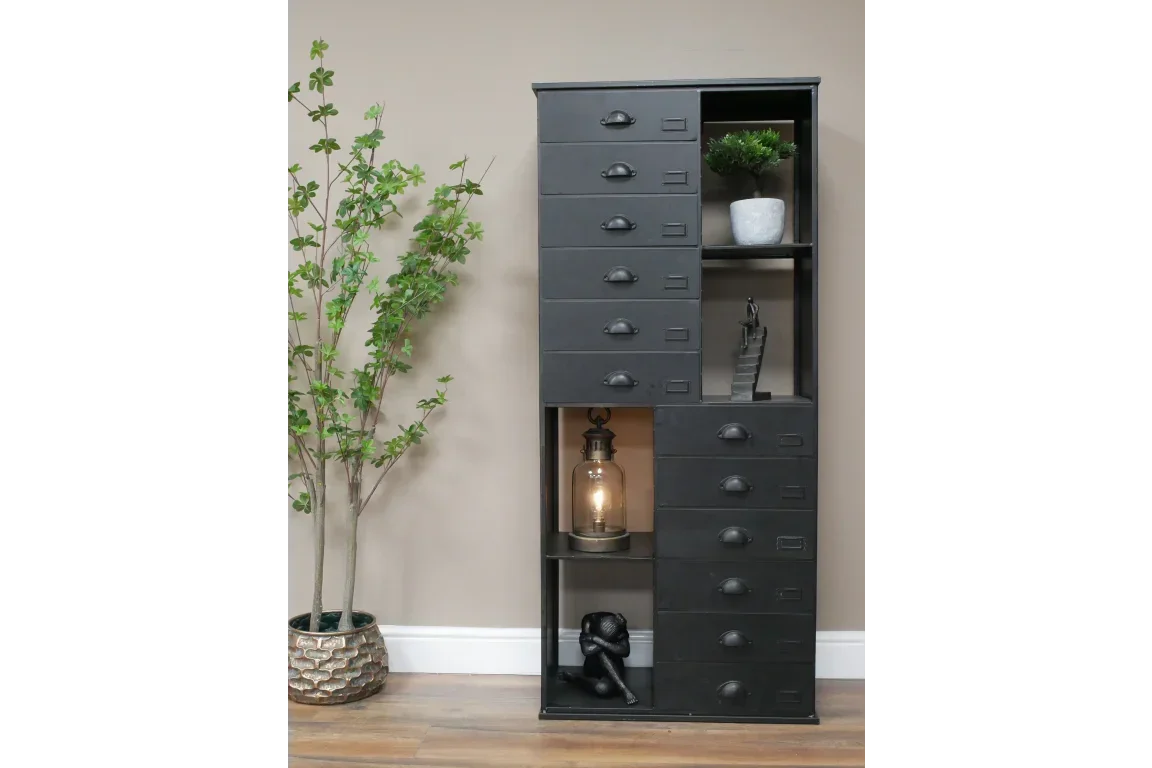 Black metal storage cabinet with drawers and open shelving, styled with decor accents