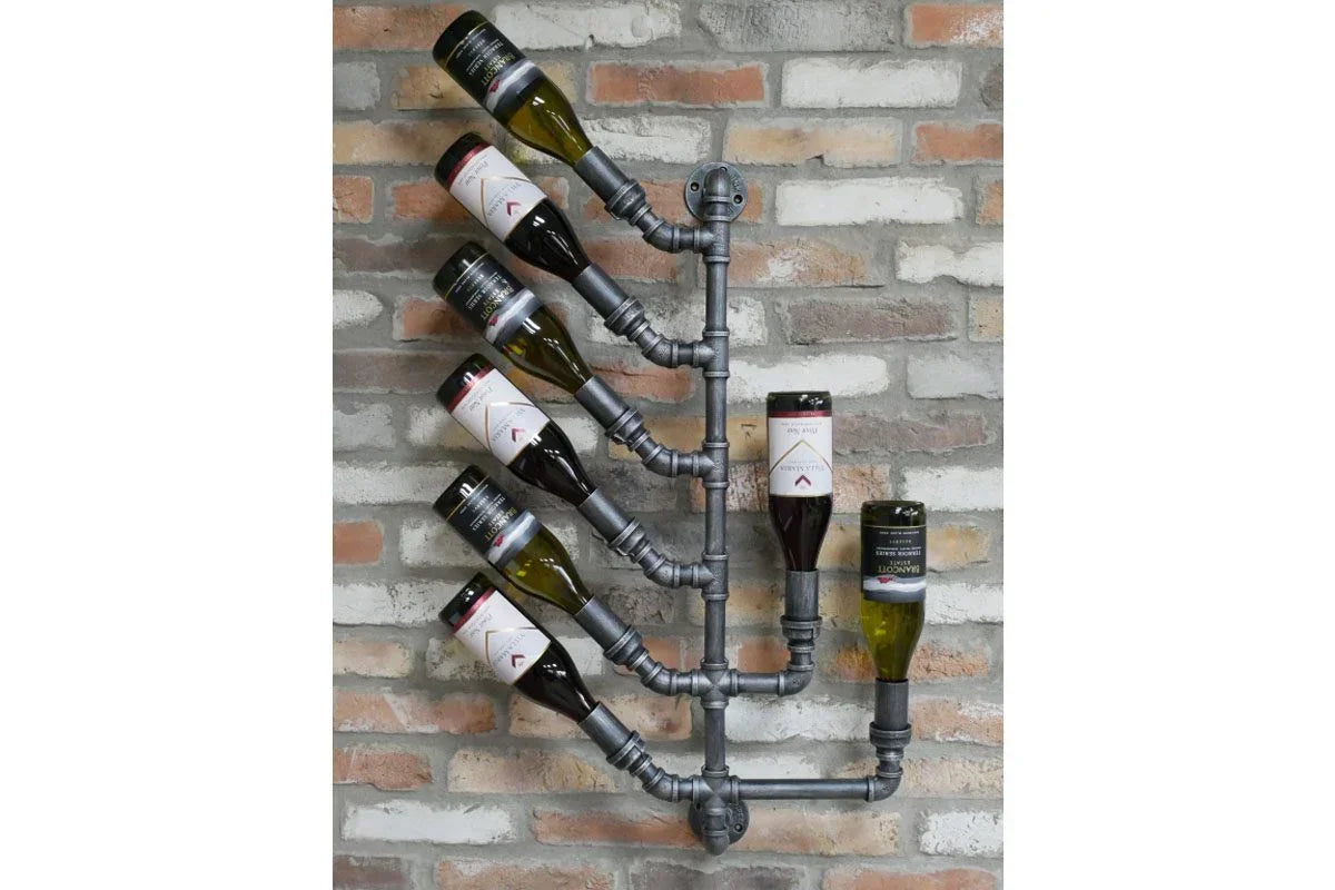 Industrial metal wine rack with six bottles mounted on exposed brick wall