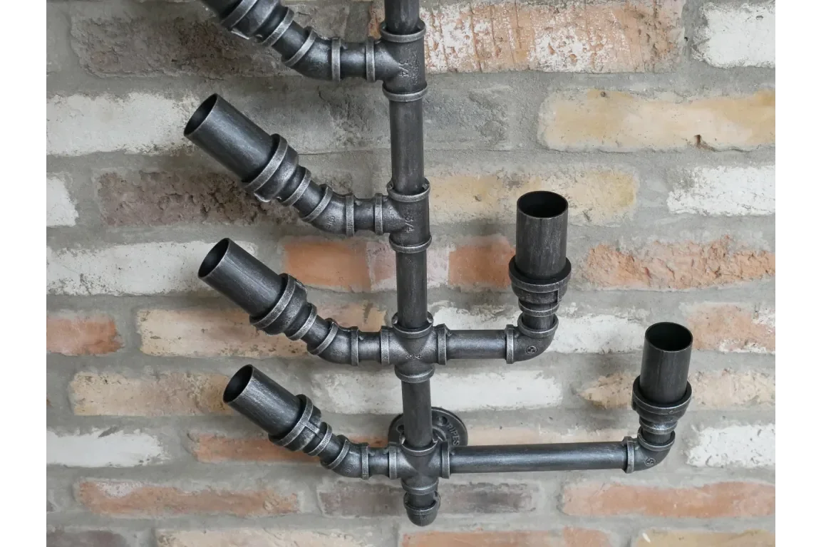 Industrial pipe wine rack wall mounted on exposed brick