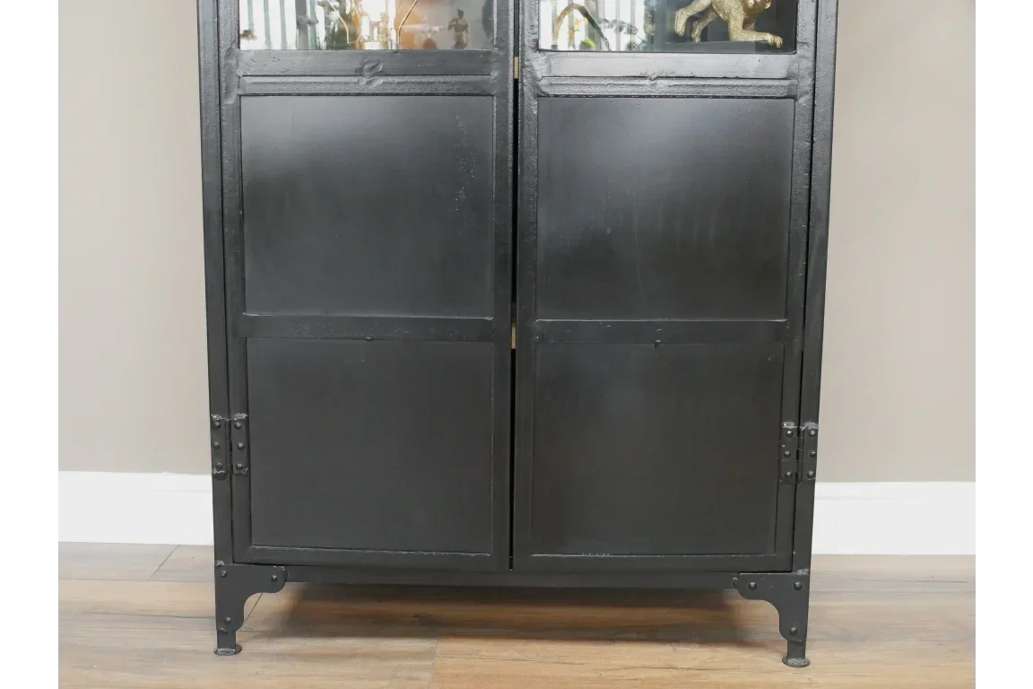 Black metal storage cabinet with lower double panel doors on wood floor