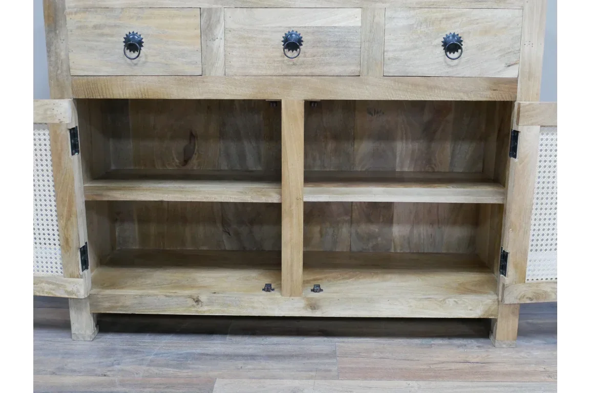 Natural wood sideboard with open shelving, three drawers, and cane panel cupboard doors