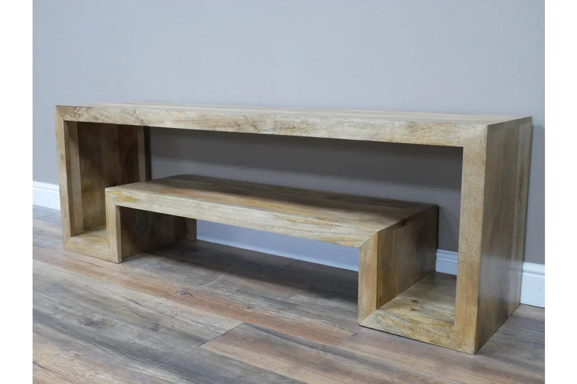 Modern mango wood console table with lower shelf, natural finish, against grey wall