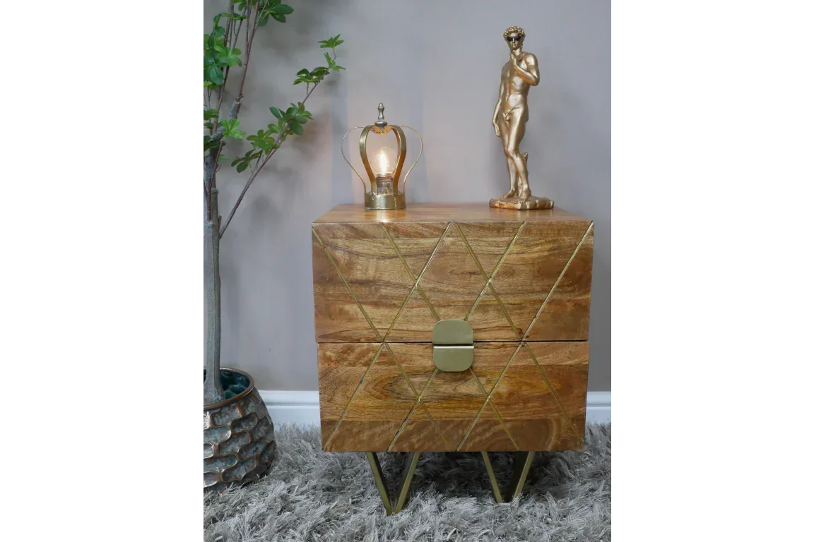 Geometric mango wood bedside table with brass handles and modern decor on top