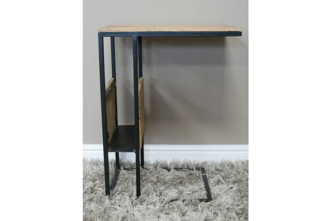 Industrial style side table with black metal frame and wooden top, magazine storage base