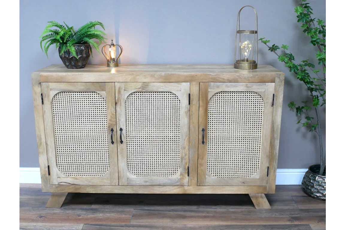 Light oak sideboard with rattan doors, black handles and decorative accents on top